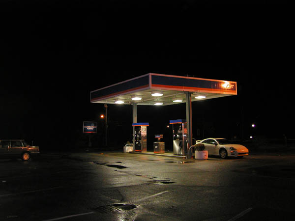 old gas station at night